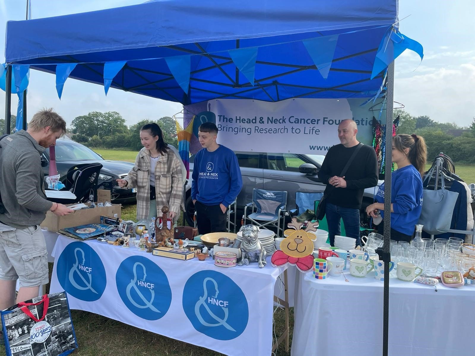A group fundraising for the Head & Neck Cancer Foundation through a car boot sale