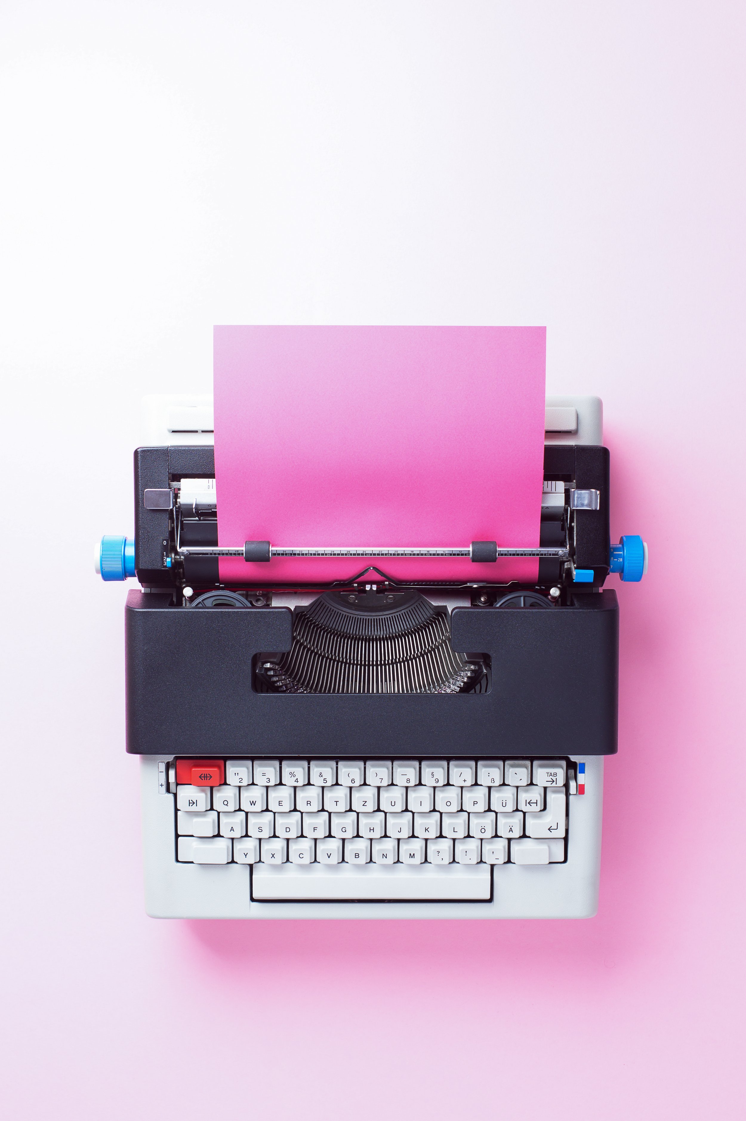 A pink and blue typewriter