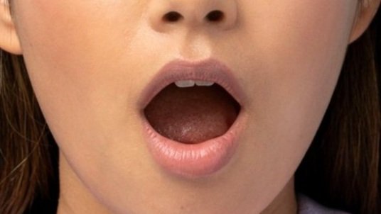 Mouth open to look for signs of cancer